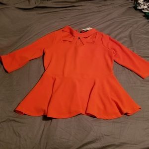 Peplum top with caged detail